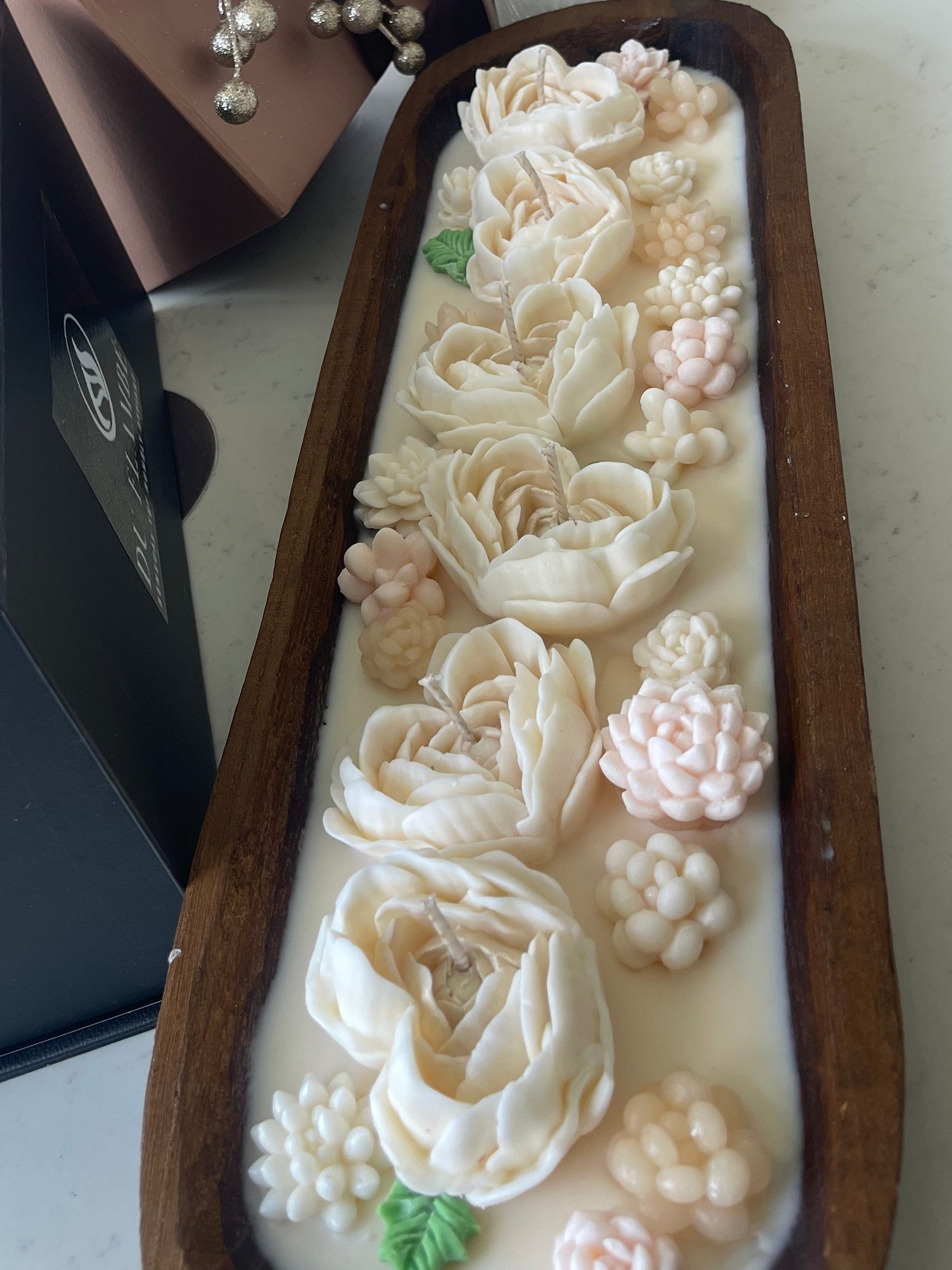 DUFLAMBÉ floral dough bowl candle centerpiece with carved wood bowl, handcrafted wax flowers and long-lasting home fragrance. Layered wax flowers, botanical accents and multiple wicks for an elegant centerpiece